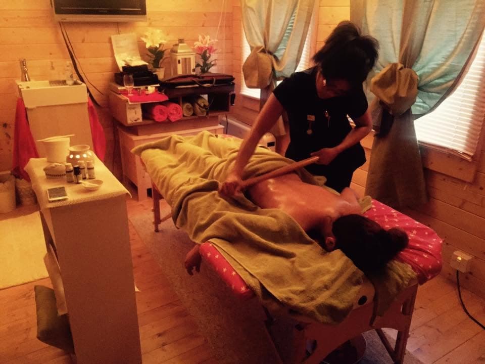 Warm bamboo massage in the log cabin studio, Stoke-on-Trent