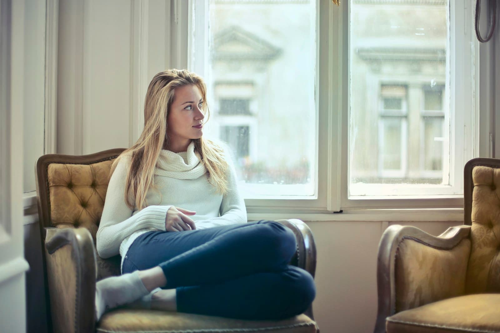 A woman resting calmly with a hand resting on her lower abdomen