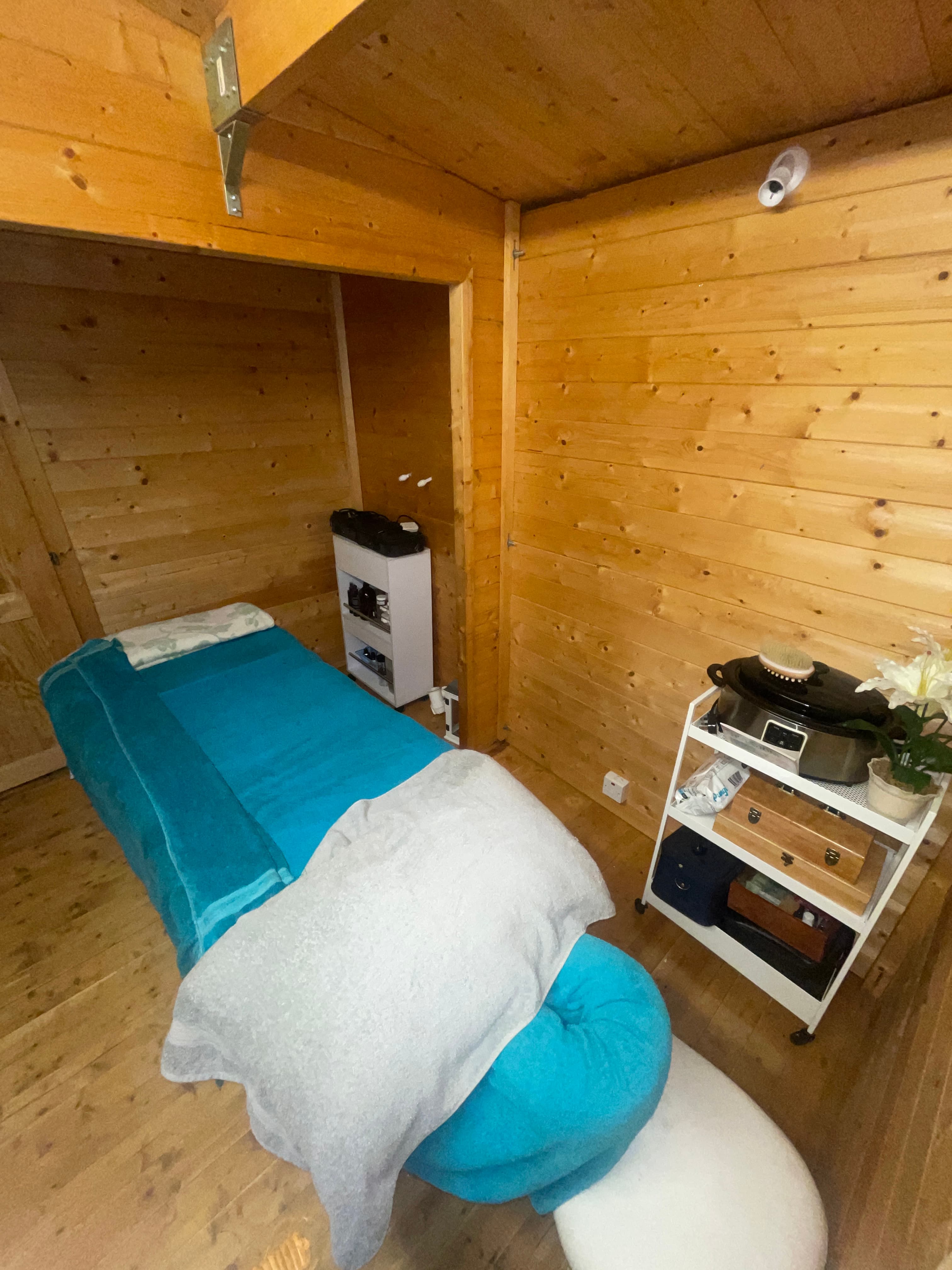 Inside the Essential Massage log cabin studio, the treatment room, Stoke-on-Trent